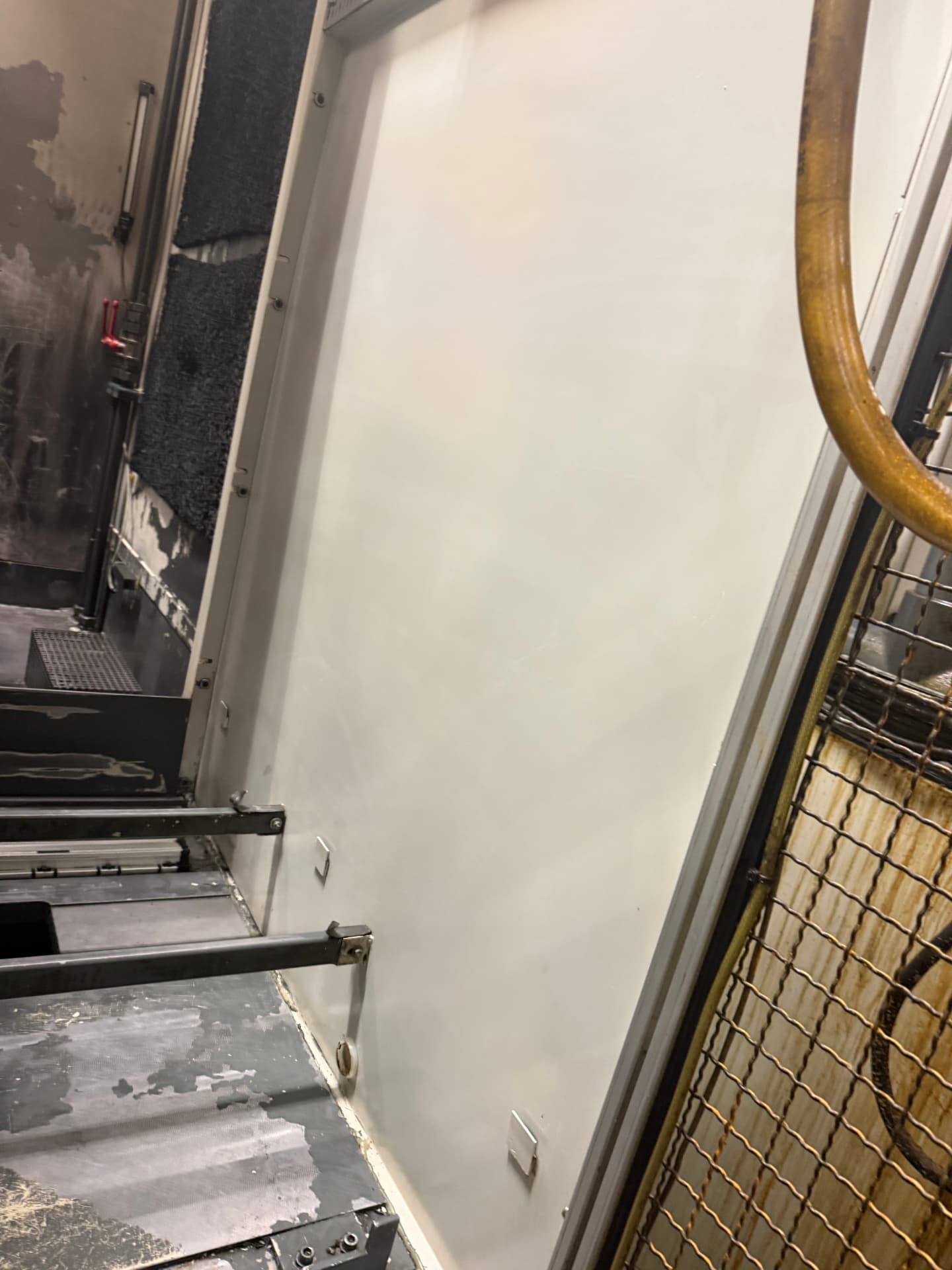 Cleaned machine enclosure panels within a production facility