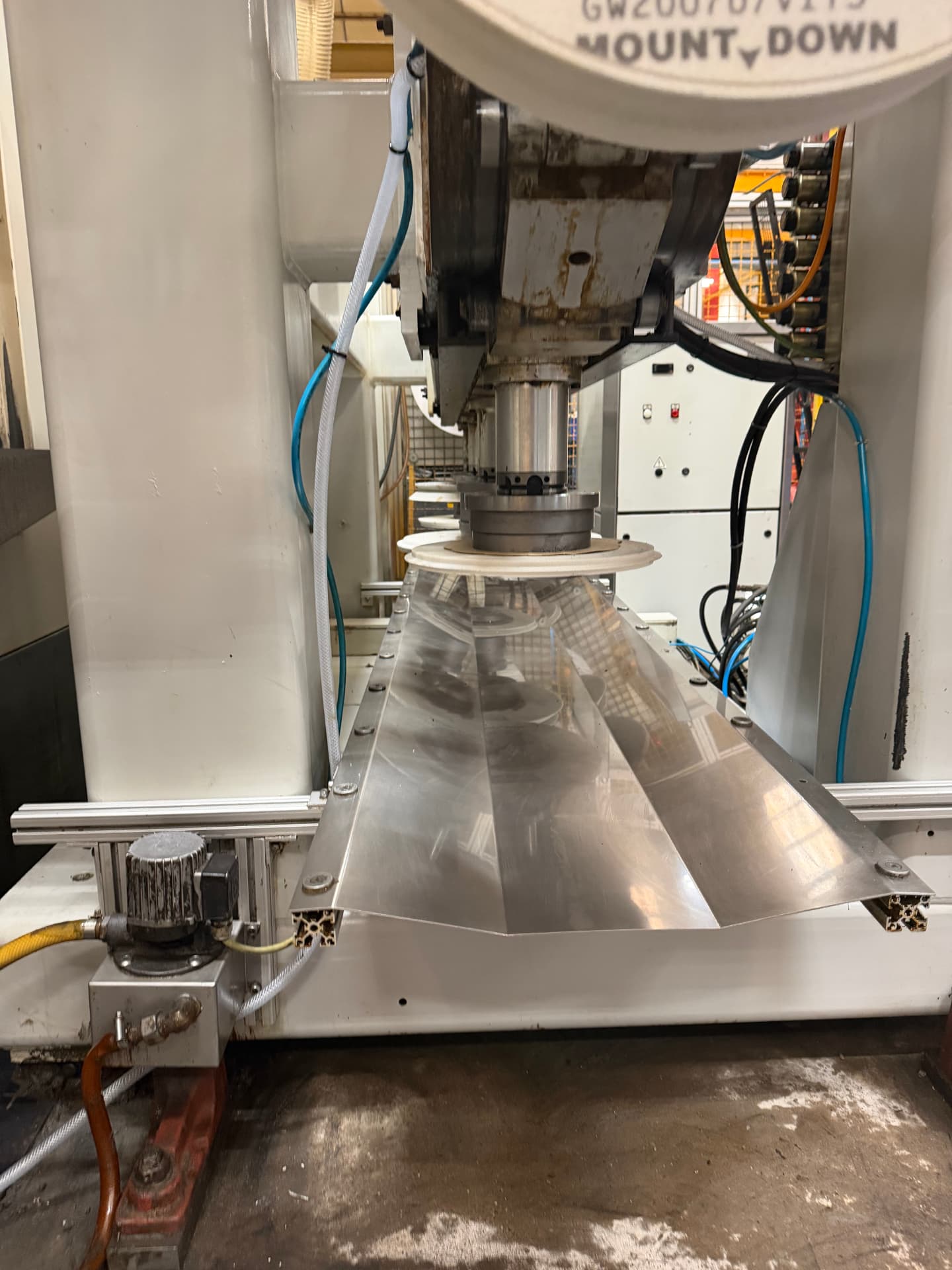 Cleaned machine bed and tray surfaces on a multi-spindle machining line